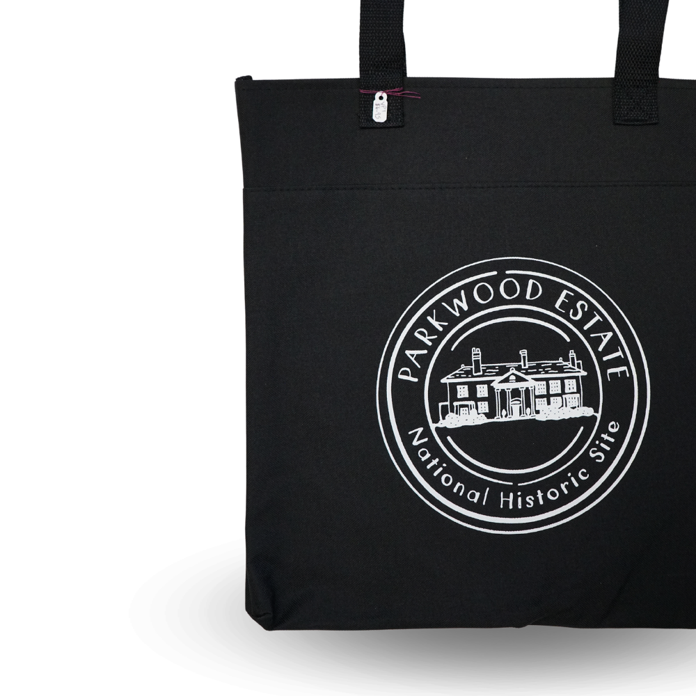 black tote bag with a white round Parkwood Estate logo on the front