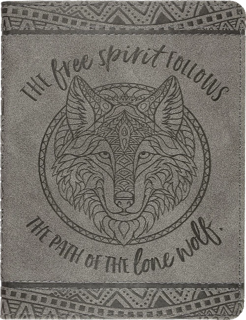 grey journal with a dark grey intricate design on the top and bottom, with an intricate wolf design with text around it that says "The free spirit follows the path of the lone wolf"