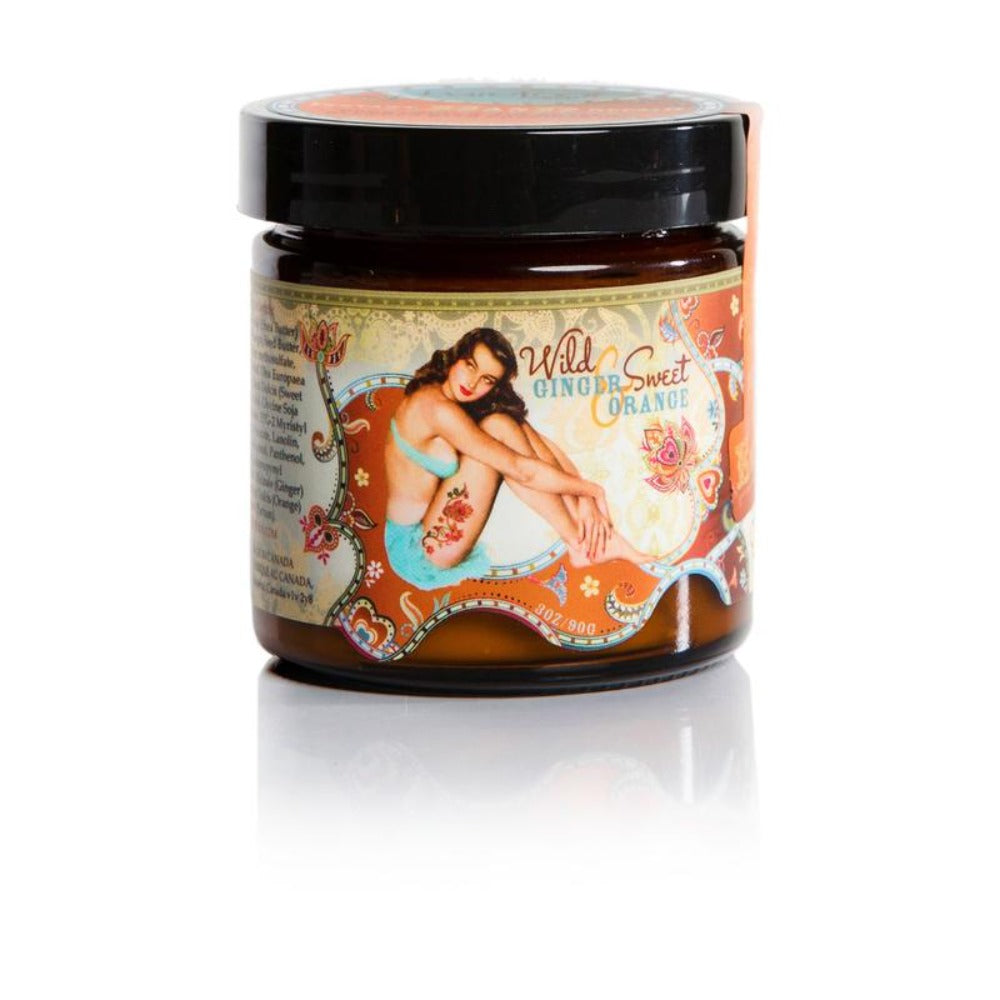 Black cream container with a light green, light blue and orange intricate design and a sitting pin up model wearing light blue 