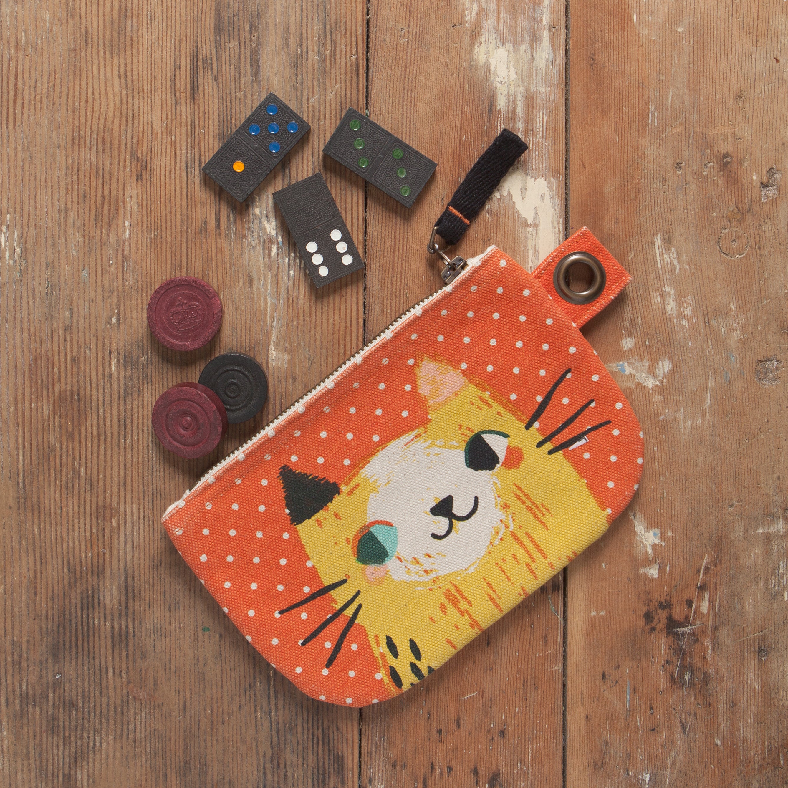 orange zip up pouch with white polka-dots and multi-coloured cat with dominoes and checker pieces