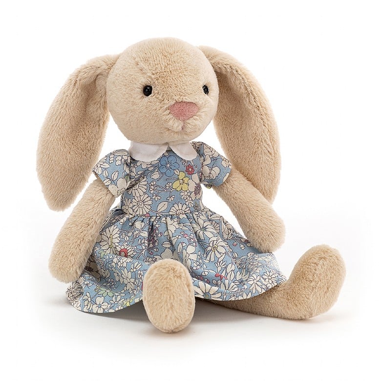 Light beige plush fluffy bunny rabbit wearing a light blue floral city 