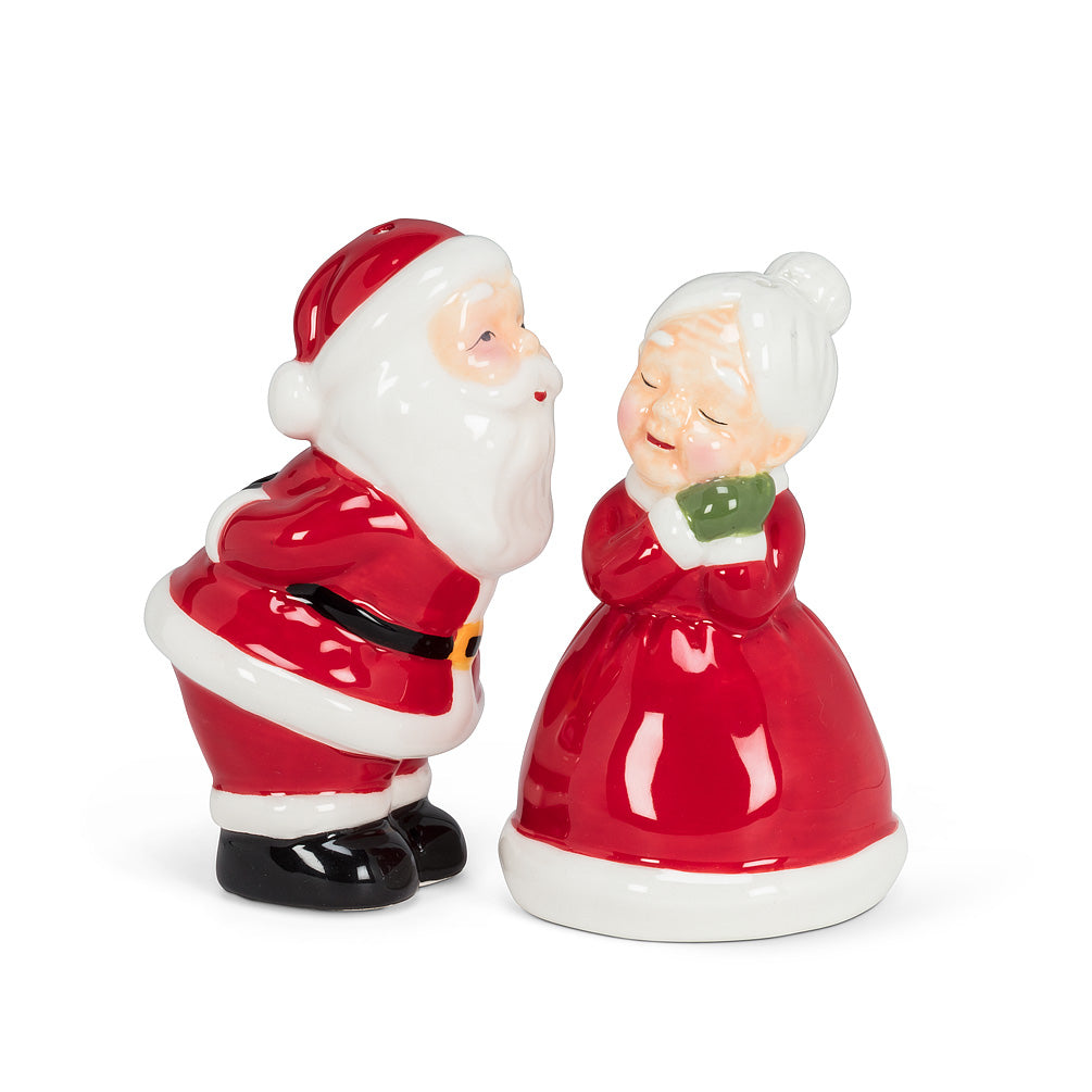 two salt and pepper shakers in the shape of mr and mrs claus