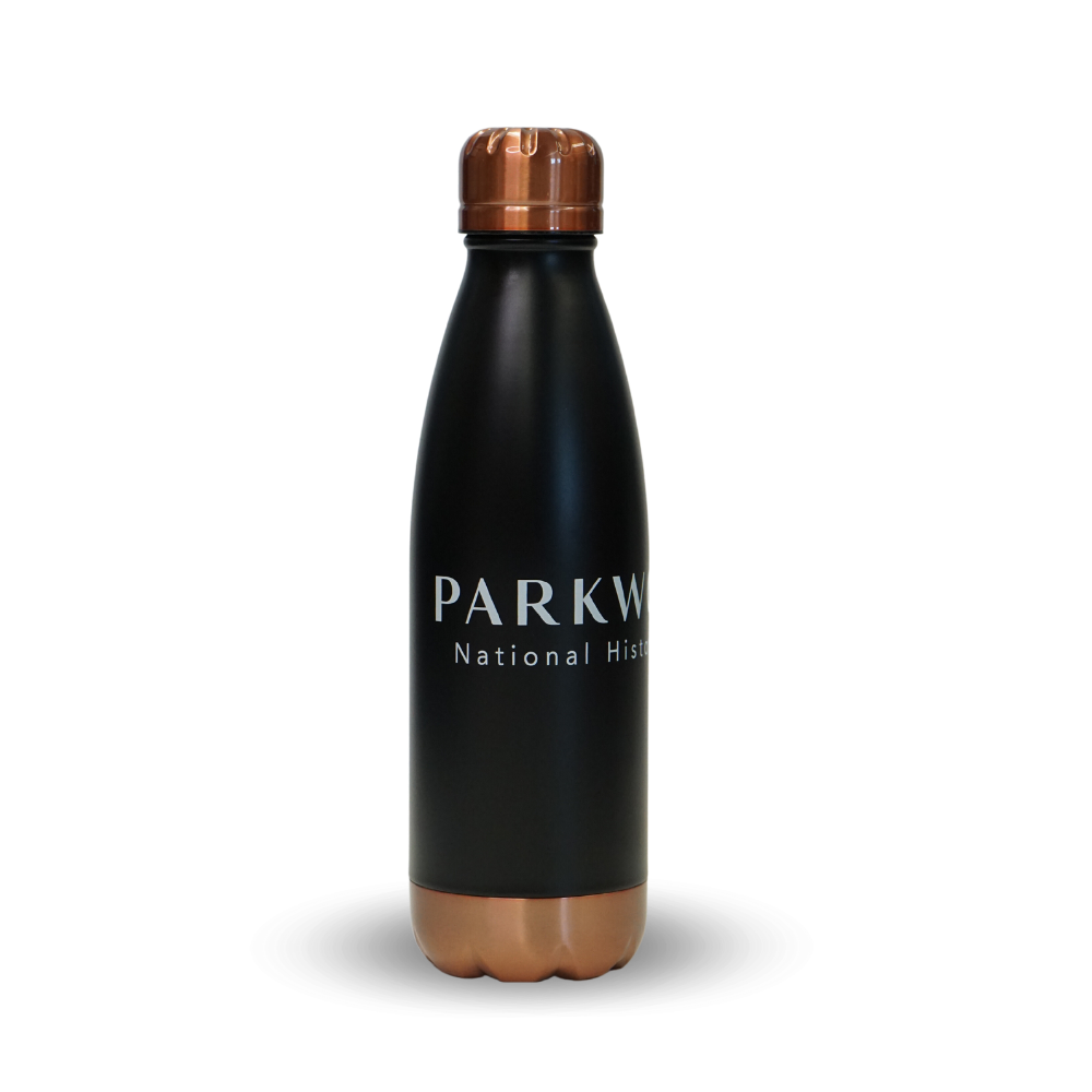 Tall metal water bottle with a navy baze, bronze bottom and lid with "Parkwood National Historic Site" etched in the midde of it