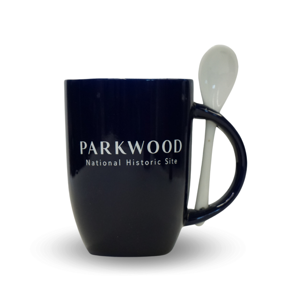 Navy blue mug with the Parkwood logo, and a grey spoon in the handle of the mug