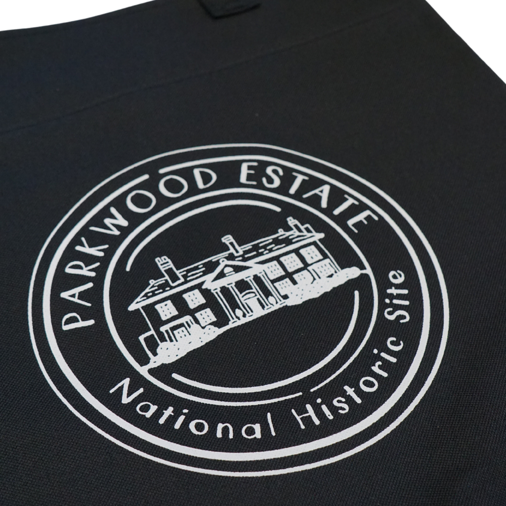 Alternate view of a black tote bag with a white round Parkwood Estate logo on the front