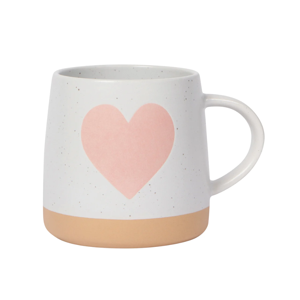 white mug with a tan bottom, and a light pink heart printed in the middle