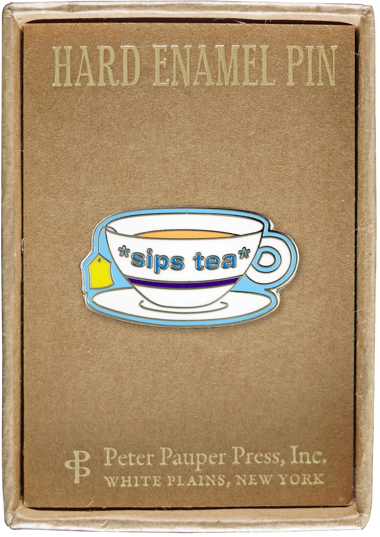 white tea glass and plate with a blue stripe, yellow tea bag label, and light blue text that says *sips tea* attached to a box that says hard enamel pin