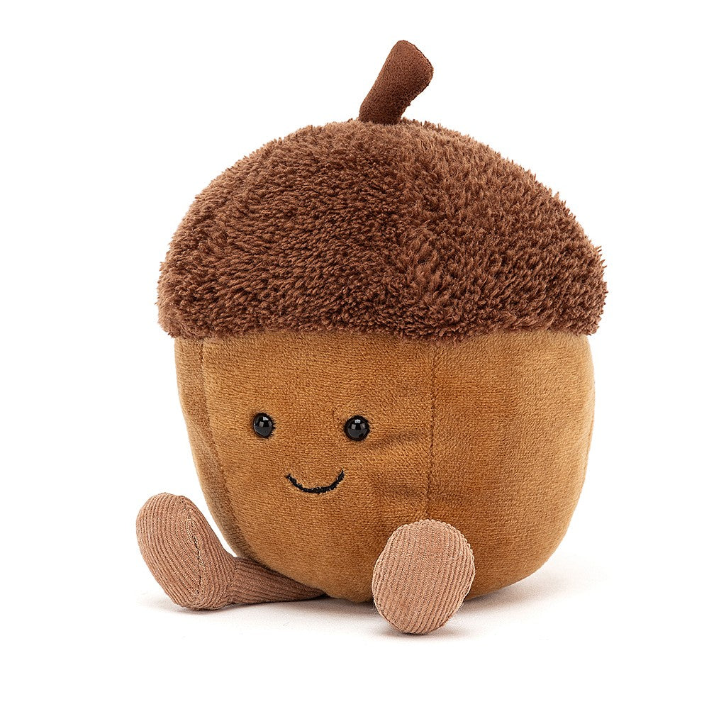 Smiling plush light brown acorn with light brown legs, and a dark brown top