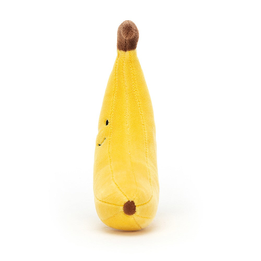 side view of a smiling plush yellow banana with a brown stem