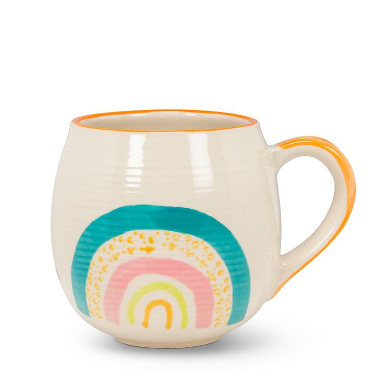 off white round mug with an illustrated rainbow at the bottom