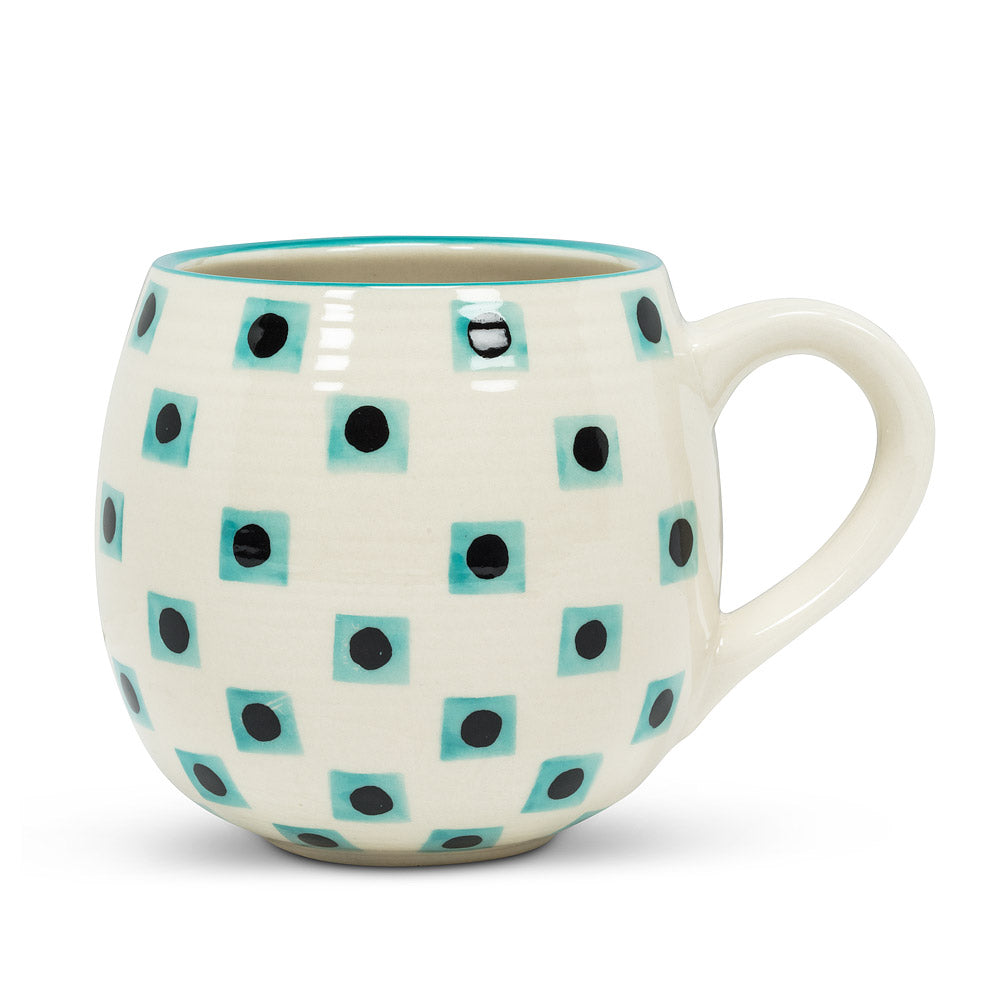 off-white round mug with a blue checkerboard pattern, with black dots in the middle of the squares