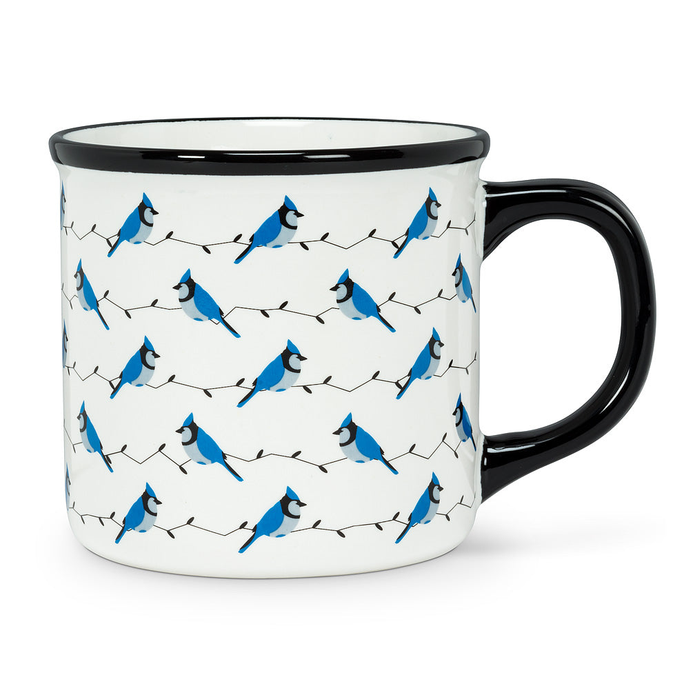 white mug with a navy blue handle and rim with blue jays perched on string lights 