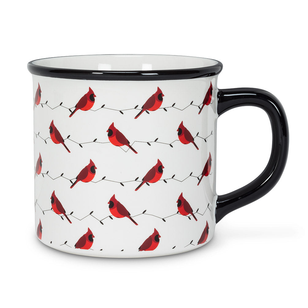 white mug with a black rim and handle that has red cardinals on string lights