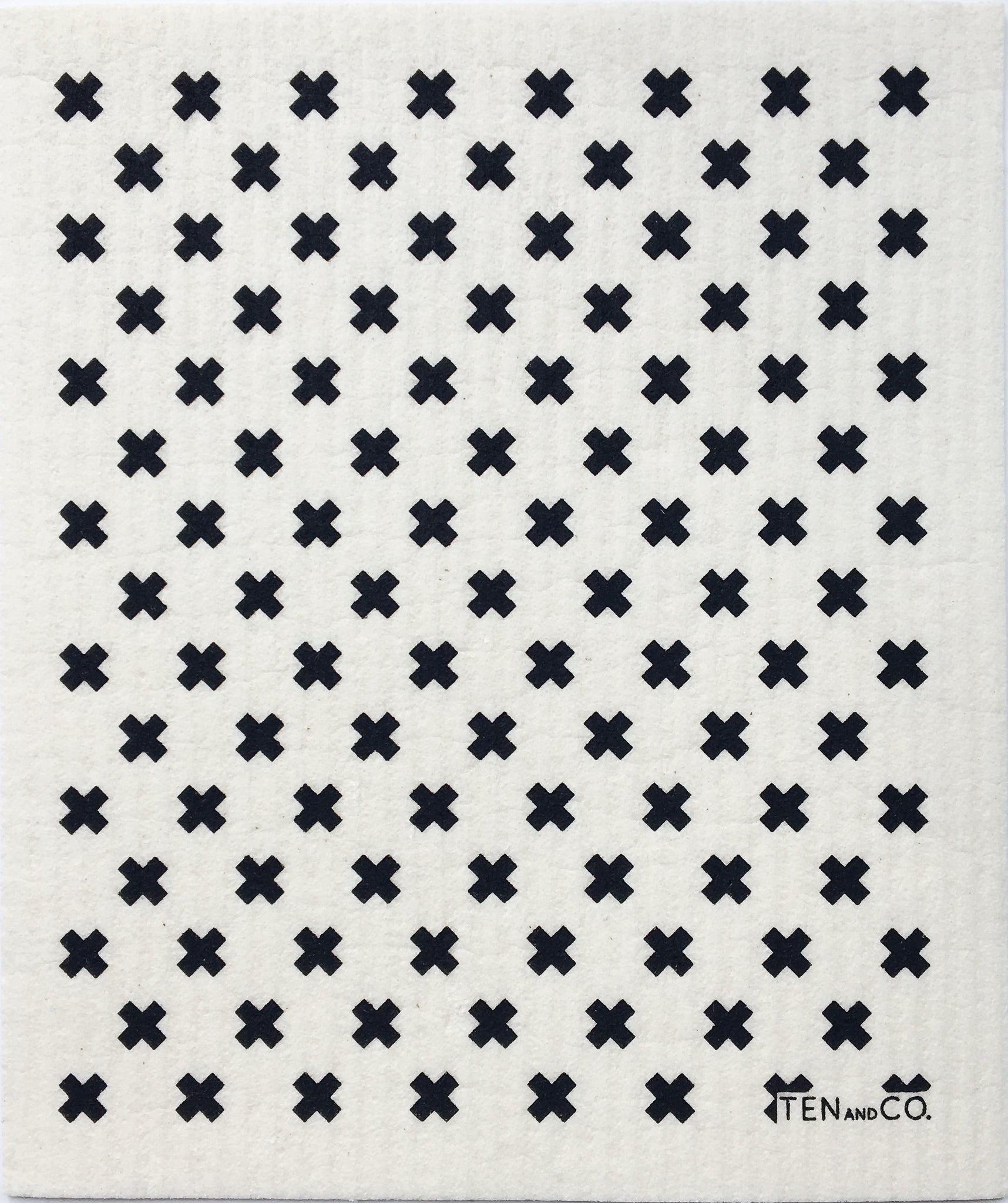 White dishcloths with black x's in a pattern covering it