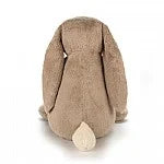 bak of a soft blush light brown bunny with long floppy ears and a light beige fur 
