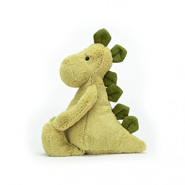 side view of a light green plush dino 