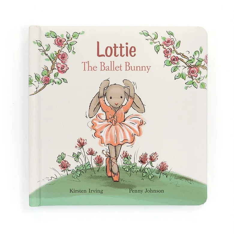White book cover with flowers, a green grassy hill, a grey cartoon bunny in a pink dress, and text that reads "Lottie The Ballet Bunny"