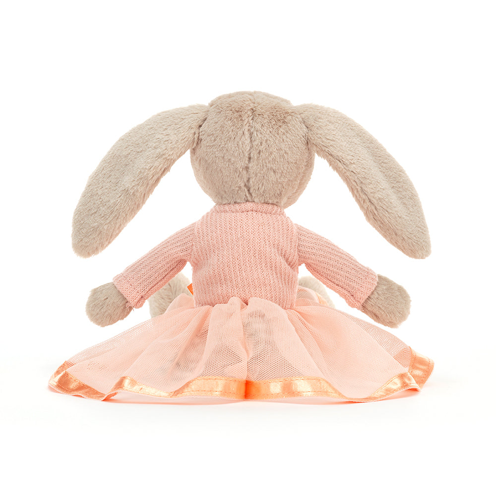 Rear view of a fluffy grey plush bunny wearing a pink dress