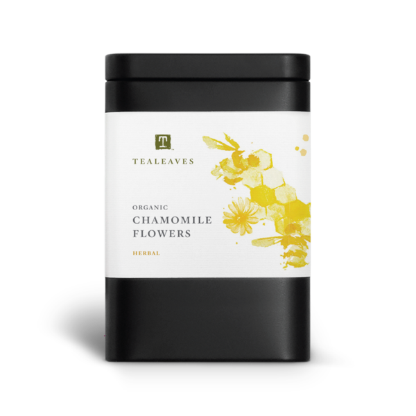 Black rectangular container with a large white label that has the tealeaves logo and product name Chamomile Flowers