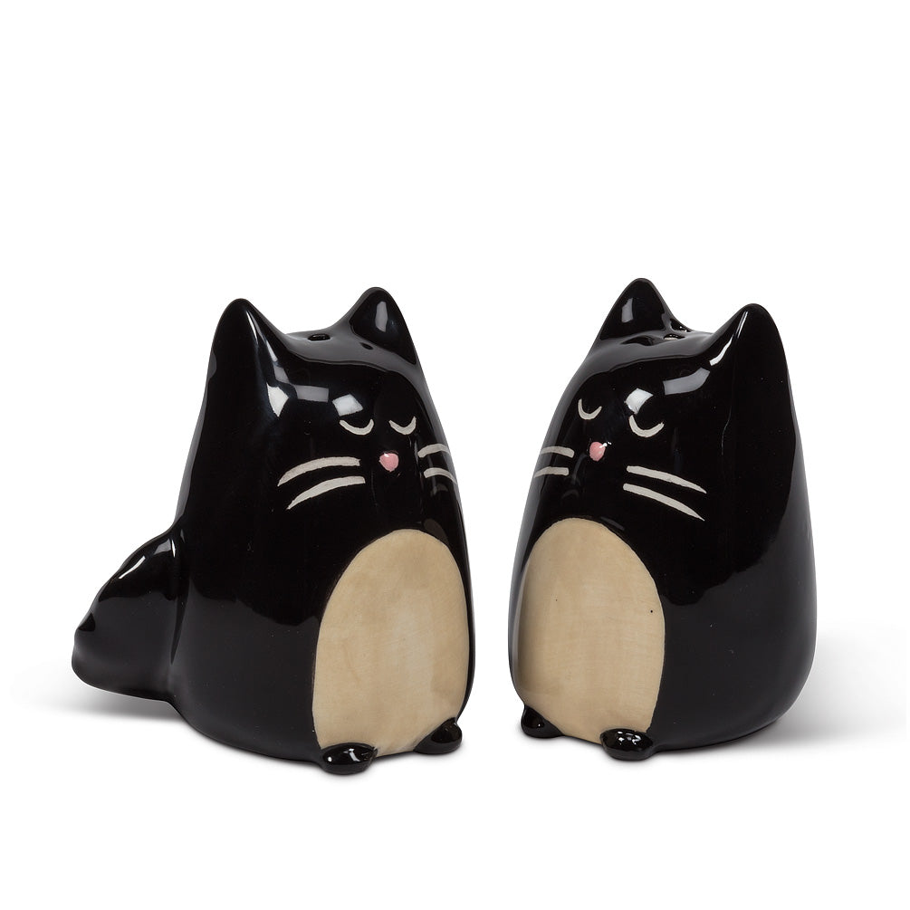 salt and pepper shakers in the shape of black cats with tan bellies