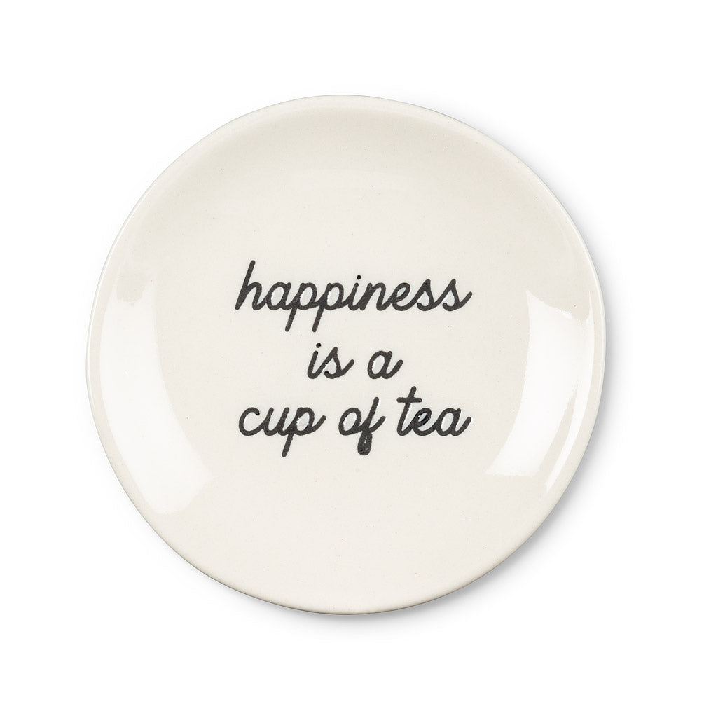 round white plate with black cursive font that says happiness is a cup of tea