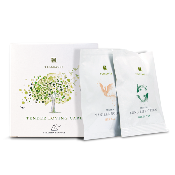 white box with the tealeaves logo, a watercolour tree, and "tender loving care" written below it with two tea packets beside it reading Vanilla Rooibos, and long life green
